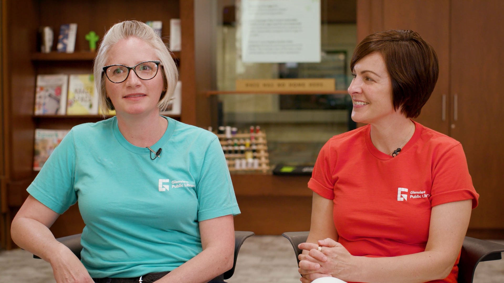 Photo of Hilary and Lindsey being interviewed that links to the video success story.